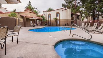 Cantera pool and hot tub view with relaxation area